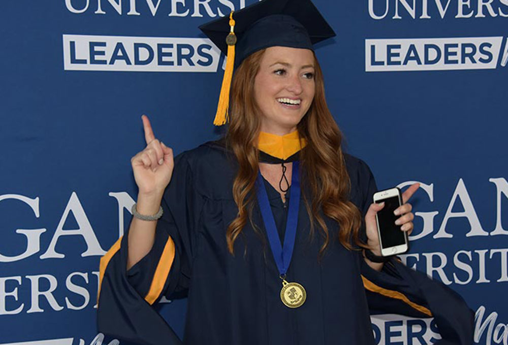 Female student smiling at graduation.