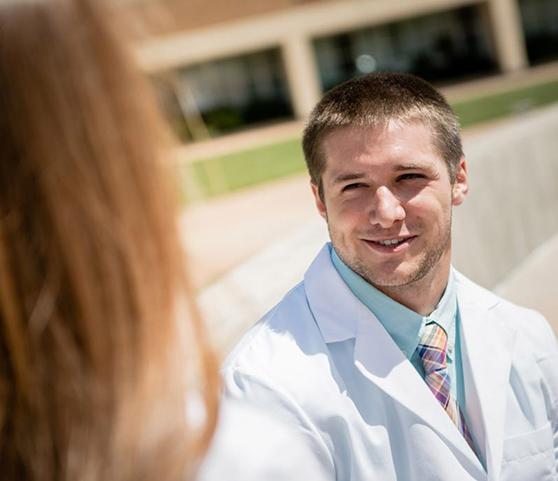 Student smiling on campus