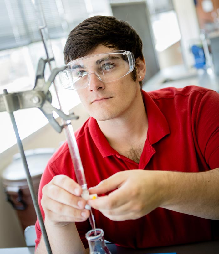 Student studying in science lab.