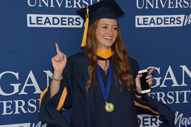 Female student celebrating graduation.