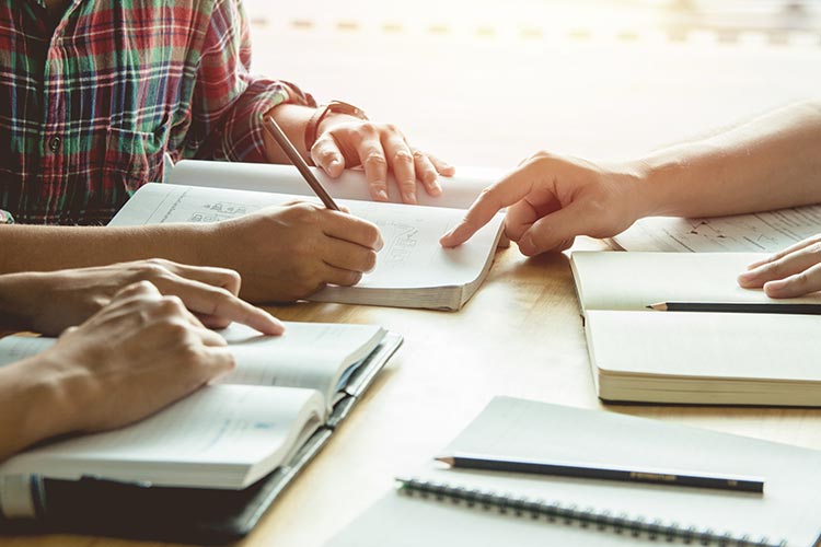 Student tutoring other students.