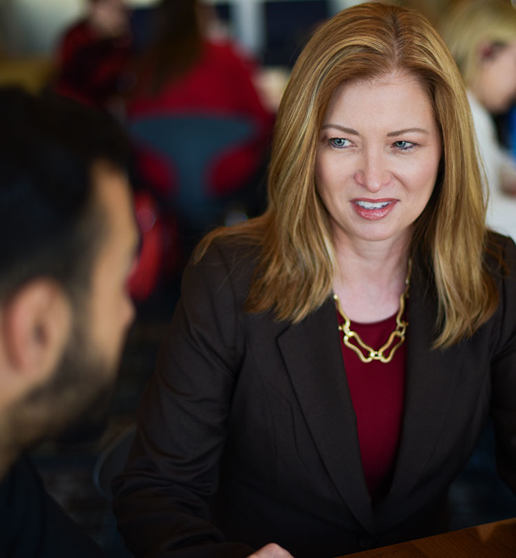 Dana Wherli talking to student.