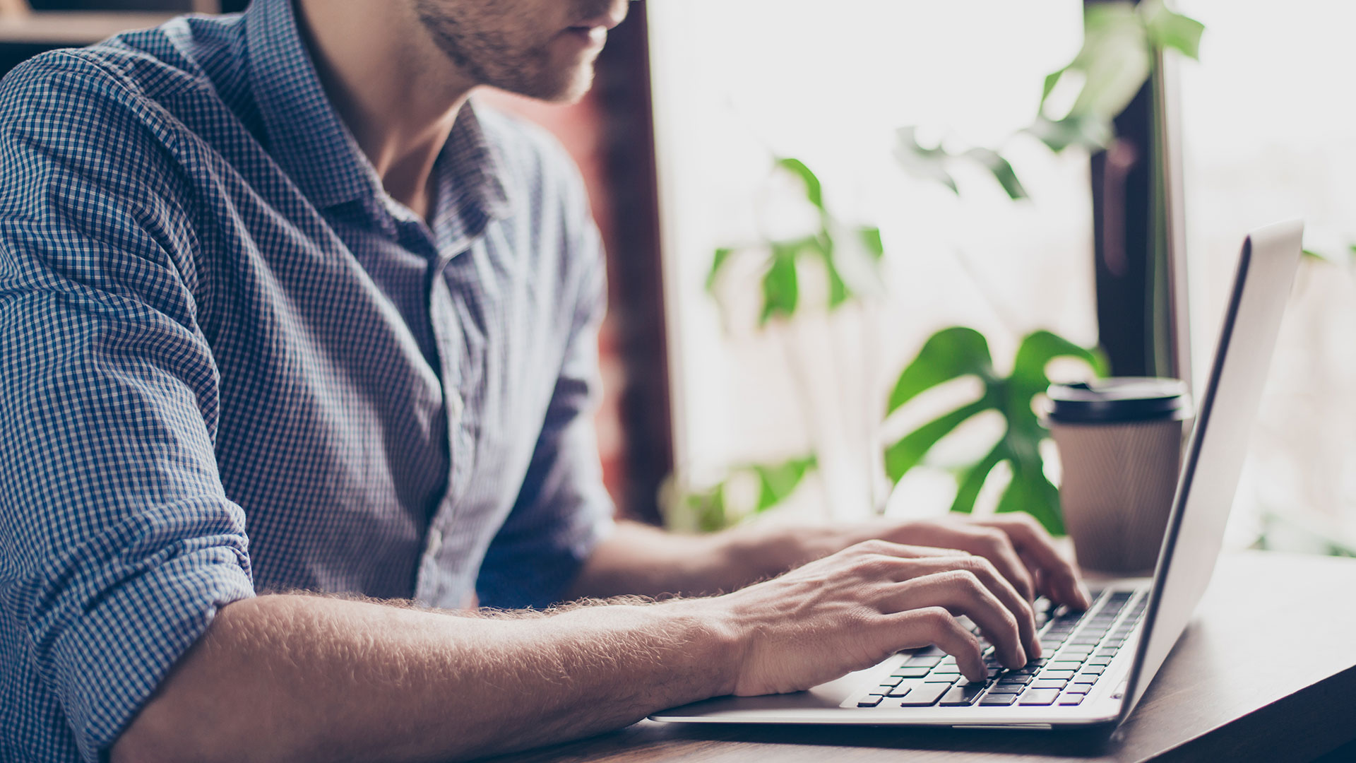 Student working on laptop.