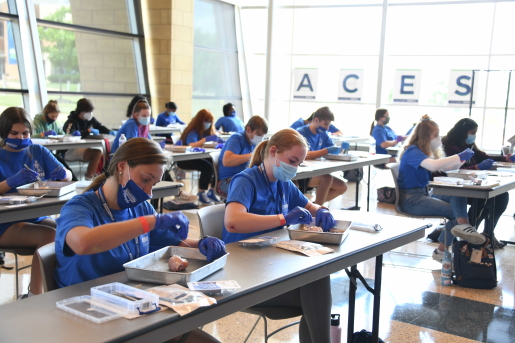 High school students learn about suturing at 威尼斯人app's fourth annual Anatomy Centered Education and Science Workshop