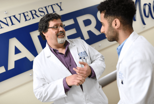 A doctor talks to a student.